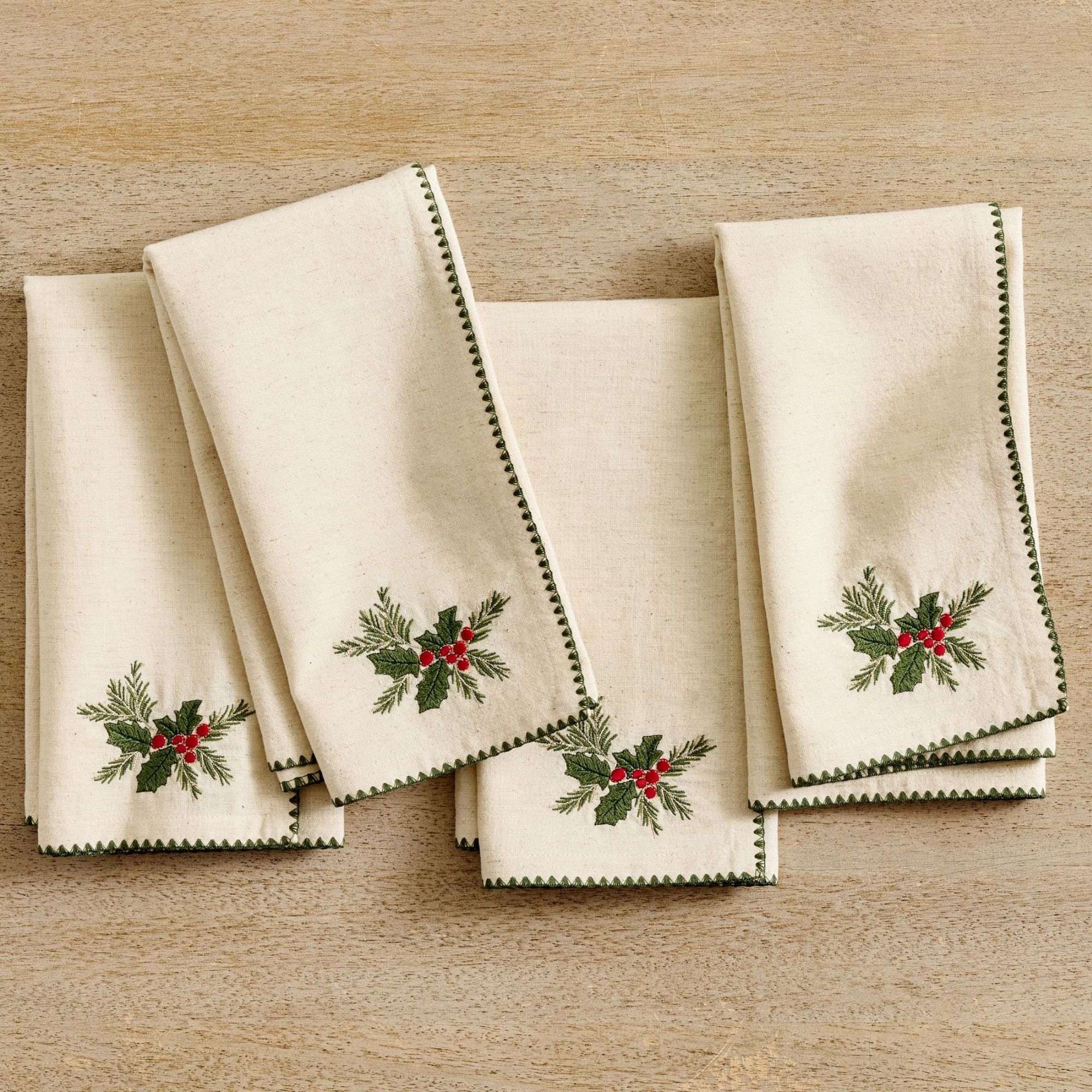Cream napkins with holly motif and green trim