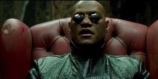 Laurence Fishburne sitting in a chair
