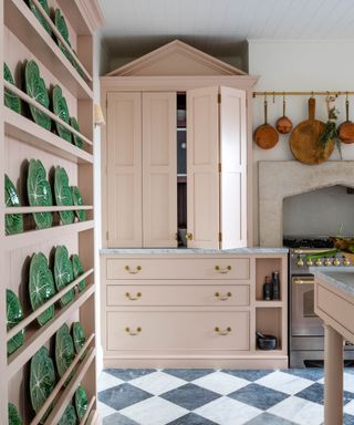 Cabbageware plates in a pale pink kitchen designed by Sean Symington