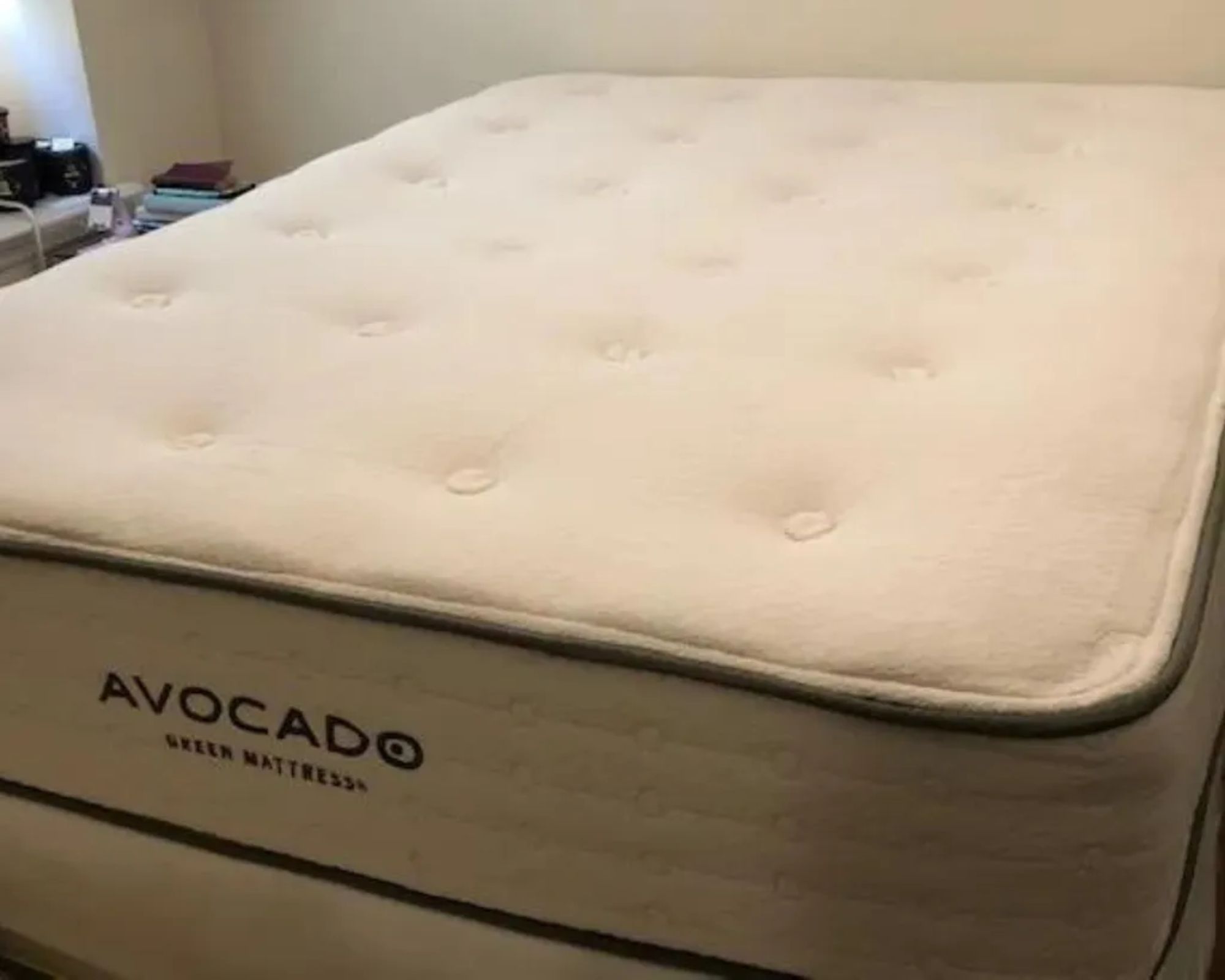 A white Avocado Green Mattress shown in a room with white walls.