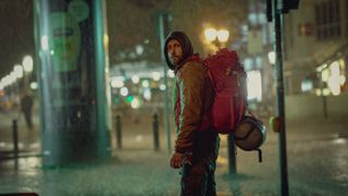Mike Atlas (Max Riemelt) roaming the city in the rain at night in Sleeping Dog