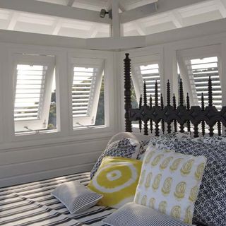 bedroom with window shutters