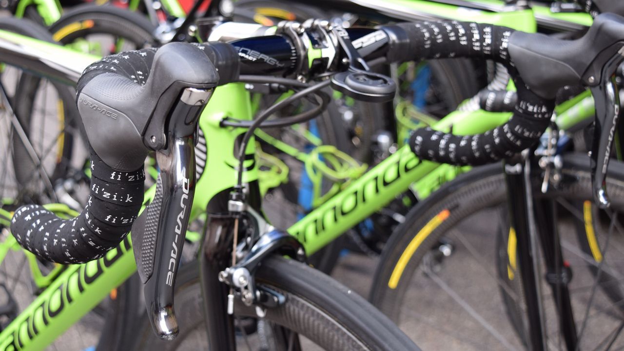 Shimano Dura-Ace 9070 shifters and Fizik handlebar tape adorn the cockpit