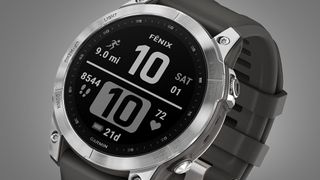 The Garmin Fenix 7 watch on a grey background