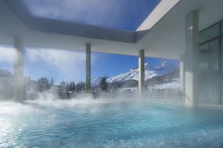 Ovaverva swimming pool with steam rising and view to mountains