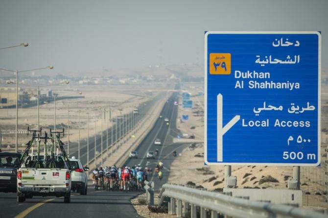 The peloton on the highway to the stage 1 finish in Dukhan.