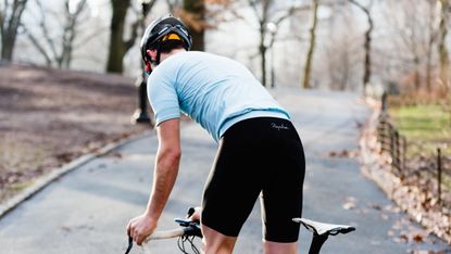 best cycling shorts: rearview shot of a rider in autumn weather