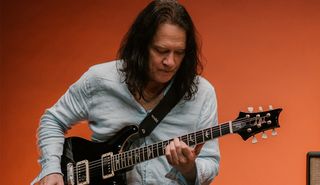 Robben Ford holds his new signature PRS McCarty guitar