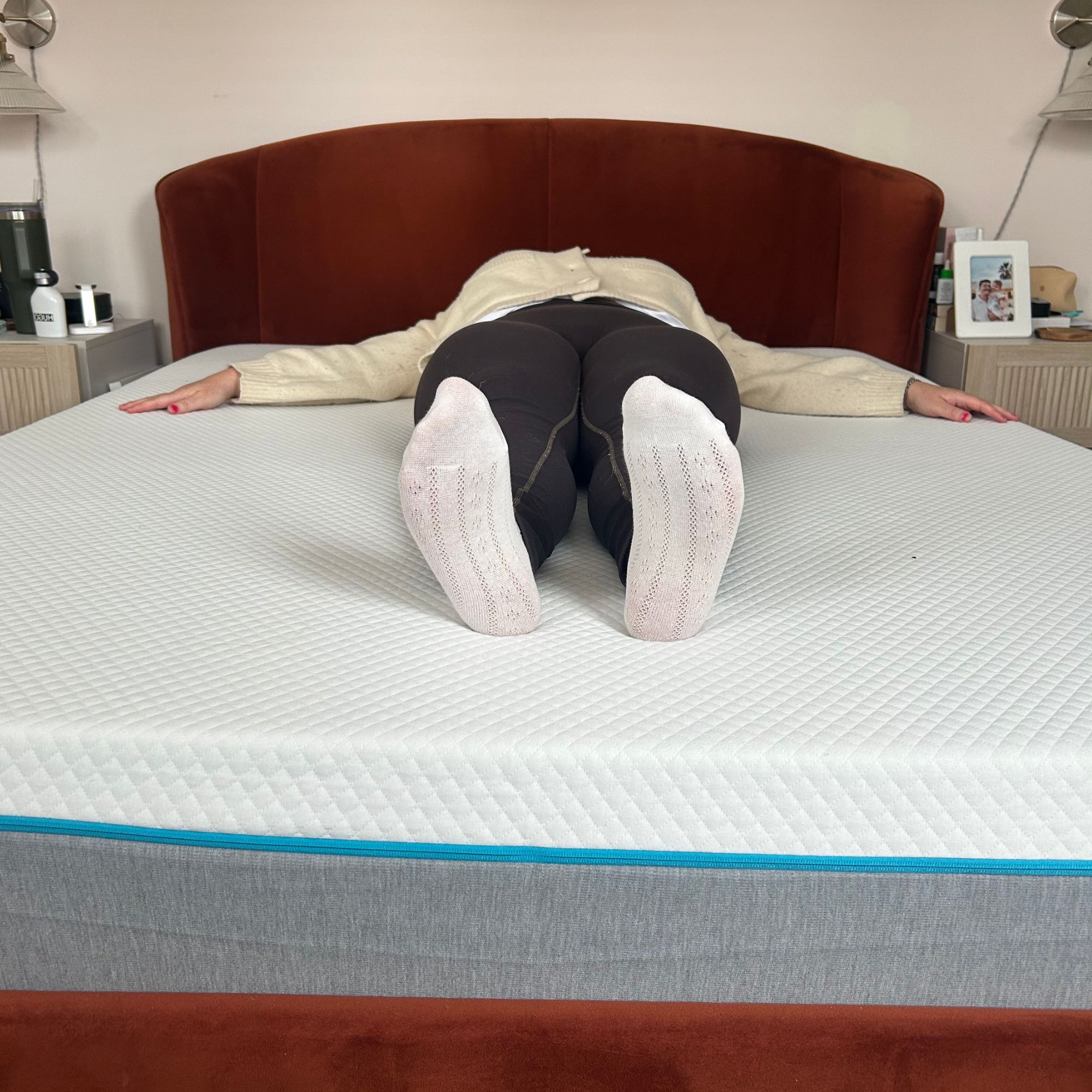 Annie laying on Simba mattress on back