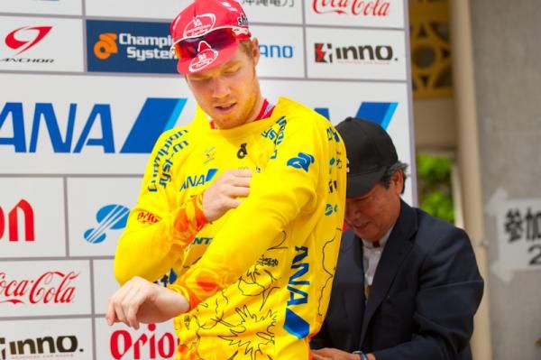 Palmer slips into the leader's yellow jersey.