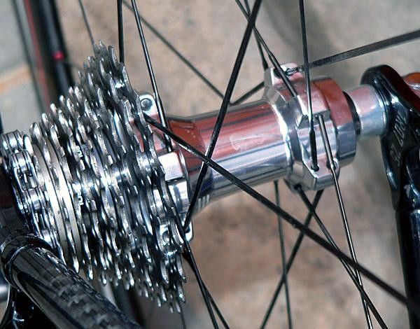 Rear hub internals are supposed the same but nipples have moved away from the hub flange and standard straight-pull spokes are used.