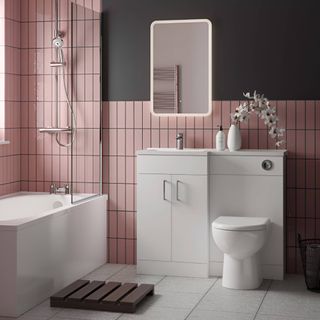 pink tiled bathroom with white all in one combination vanity unit