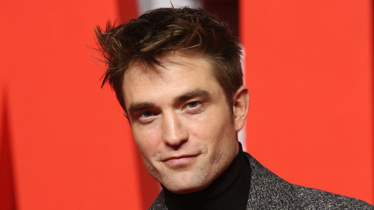 robert pattinson on a red background