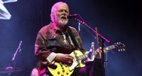 Randy Bachman plays a Goldtop Les Paul onstage in 2025.