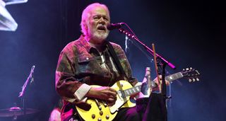 Randy Bachman plays a Goldtop Les Paul onstage in 2025.