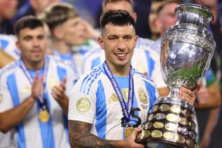 Lisandro Martinez celebrates with the Copa America trophy after Argentina's win against Colombia in the final in July 2024.