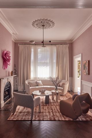 pink living room with ceiling medallion