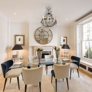 living room with white walls and dinning table with chair