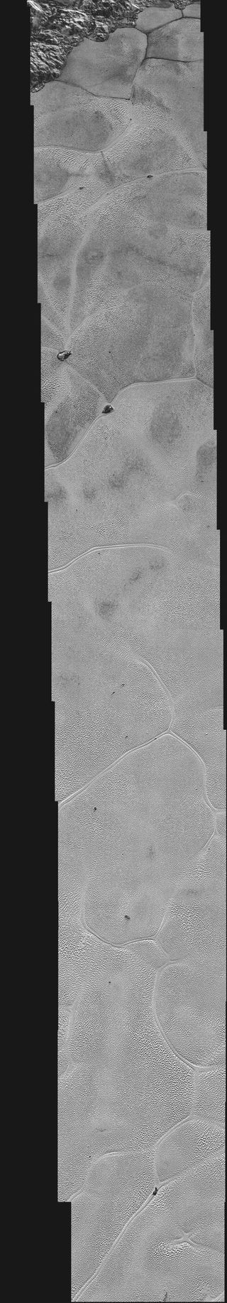 The images that make up this high-resolution view of the icy Pluto plain known as Sputnik Planum was captured by NASA's New Horizons probe on July 14, 2015.