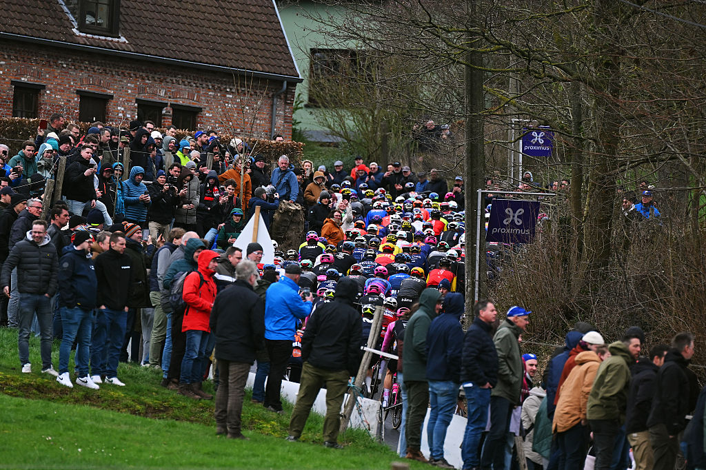 NIVONE, BELGIUM - FEBRUARY 28: A general view of the peloton passing through the Eikenberg cobblestones sector during the 21st Omloop Het Nieuwsblad 2026, Men&amp;amp;apos;s Elite a 207.2km one day race from Ghent to Ninove / #UCIWT / on February 28, 2026 in Ninove, Belgium. (Photo by Tim de Waele/Getty Images)