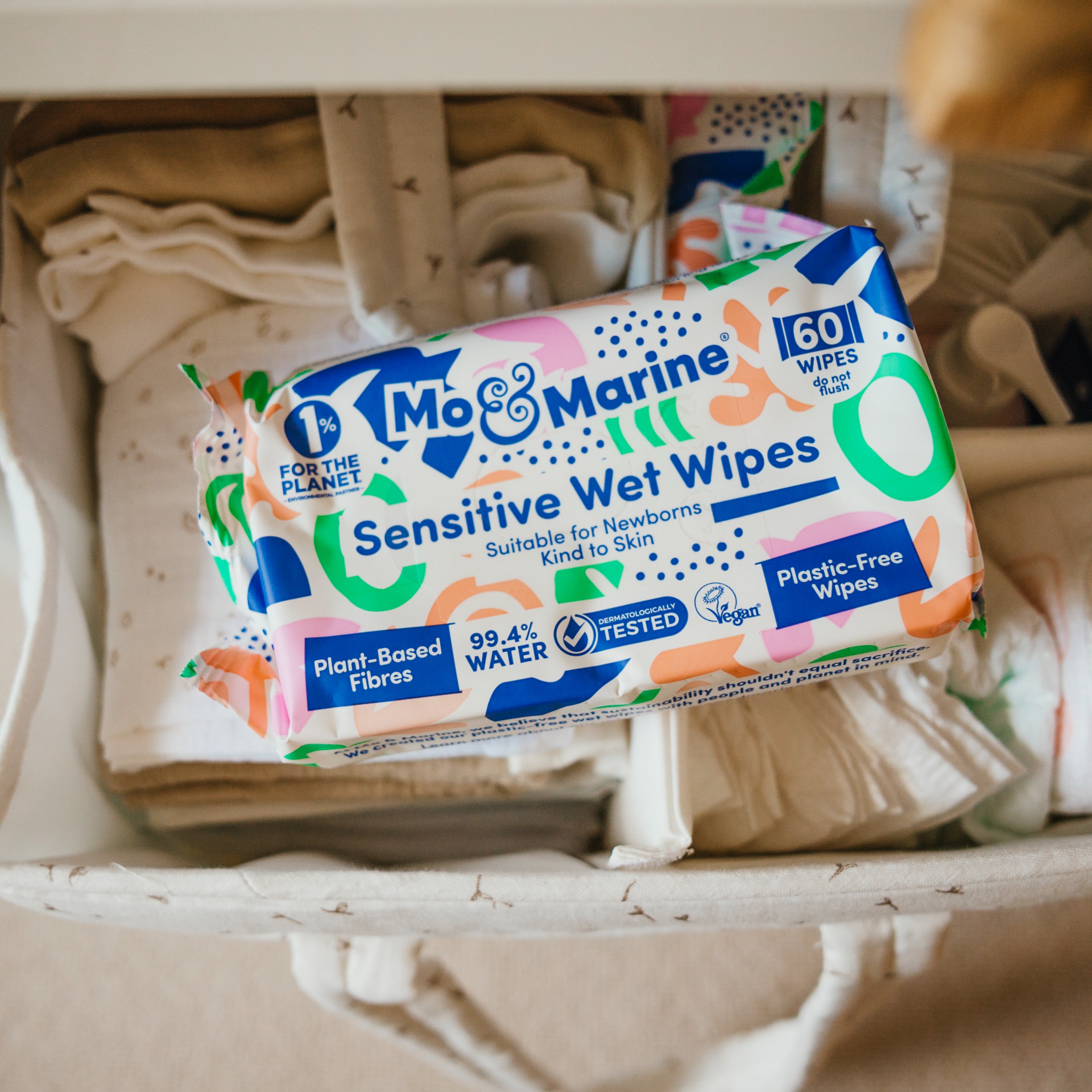 A close-up of Mo &amp;amp; Marine wet wipes in a nappy caddy
