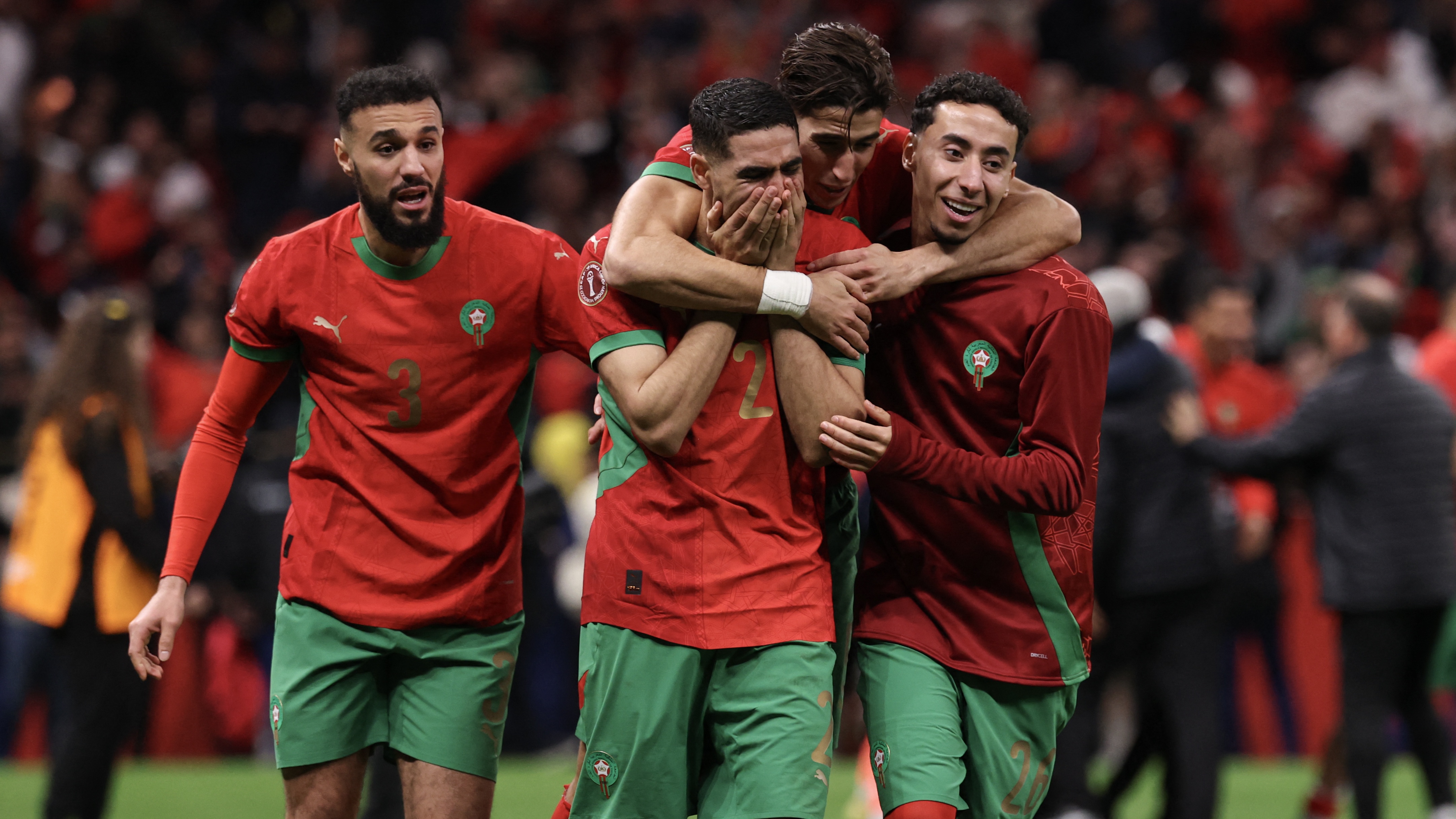 Achraf Hakimi, Nayef Aguerd and Anass Salah-Eddine celebrate winning the Africa Cup of Nations (CAN) semi-final football match between Nigeria and Morocco at the Prince Moulay Abdellah stadium in Rabat on January 14, 2026. 