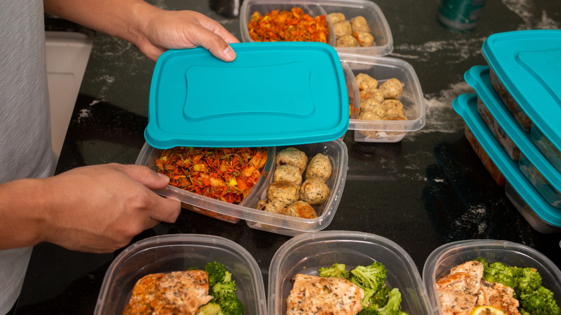 Person batch preparing meals, ready to freeze