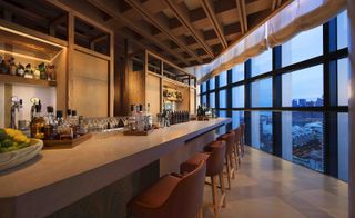 Bar area with floor to ceiling windows