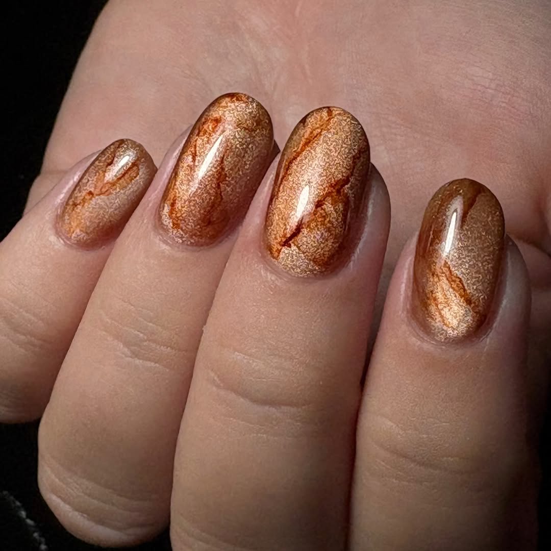 tan cat eye manicure