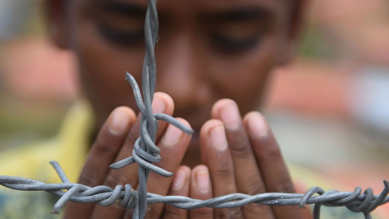 A Rohingya performs prayers at the Kutupalong refugee camp in Bangladesh