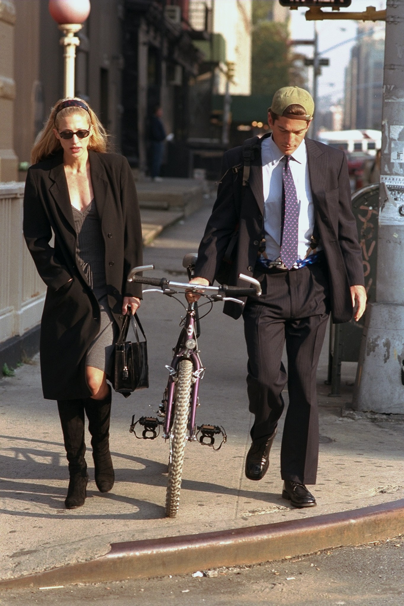 Newlyweds John F Kennedy Jr. and Carolyn Bessette Kennedy walk along Varick St.