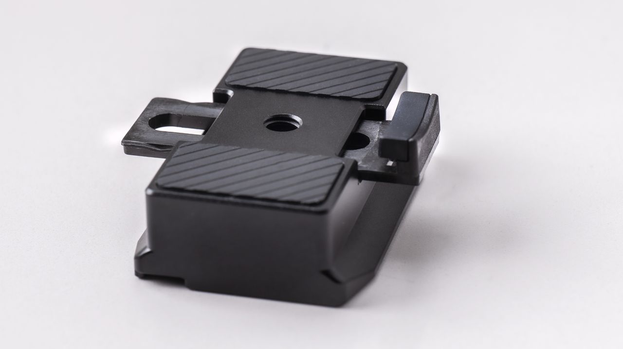 DJI RS 4 gimbal camera mount on a off-white background
