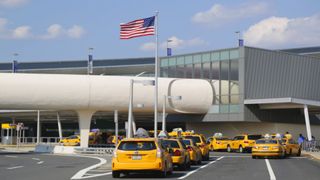 NEW YORK- JULY 10: New York Taxi line next to JetBlue Terminal 5 at John F Kennedy International Airport in New York on July 10, 2014. 