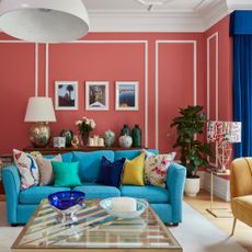 blue sofa pink walls living room