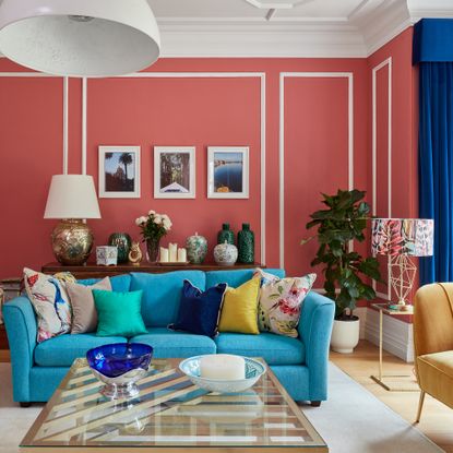 blue sofa pink walls living room