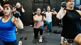 Women perform lunges holding dumbbells