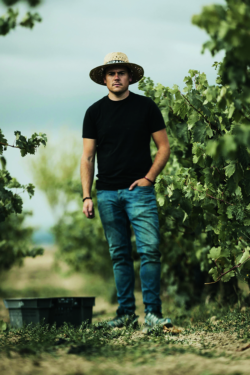 Miguel Egu&amp;iacute;luz standing in vineyard