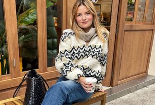 Woman in cozy sherpa sweater.