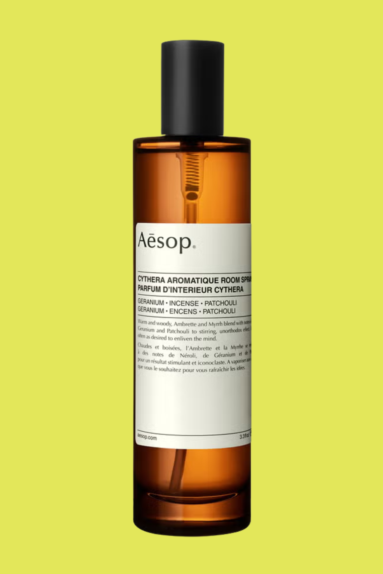 An amber glass bottle of room spray