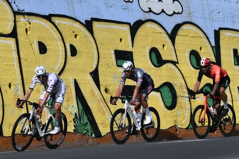 Team UAE&#039;s Slovenian rider Tadej Pogacar (L), Dutch Mathieu Van Der Poel of team Alpecin-Deceuninck (C) and Team Ineos&#039; Italian rider Filippo Ganna prepare to take a turn in la Cipressa downhill during the Milan - Sanremo one-day classic cycling race, on March 22, 2025. (Photo by Marco BERTORELLO / AFP)