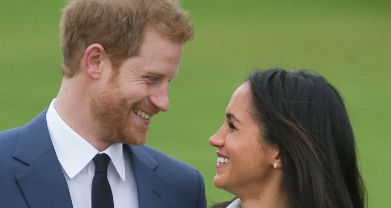 Prince Harry and Meghan Markle pose at Kensington Palace