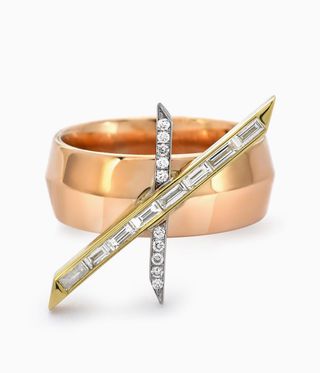 Emily P. Wheeler RIng involves a large gold band with two rectangular bands, one with diamond stones and one with diamond sections.
