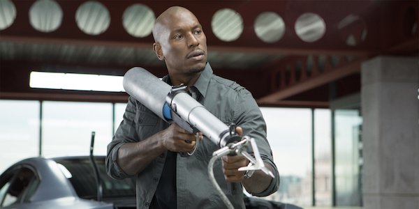 Tyrese Gibson with a harpoon gun as Roman Pearce