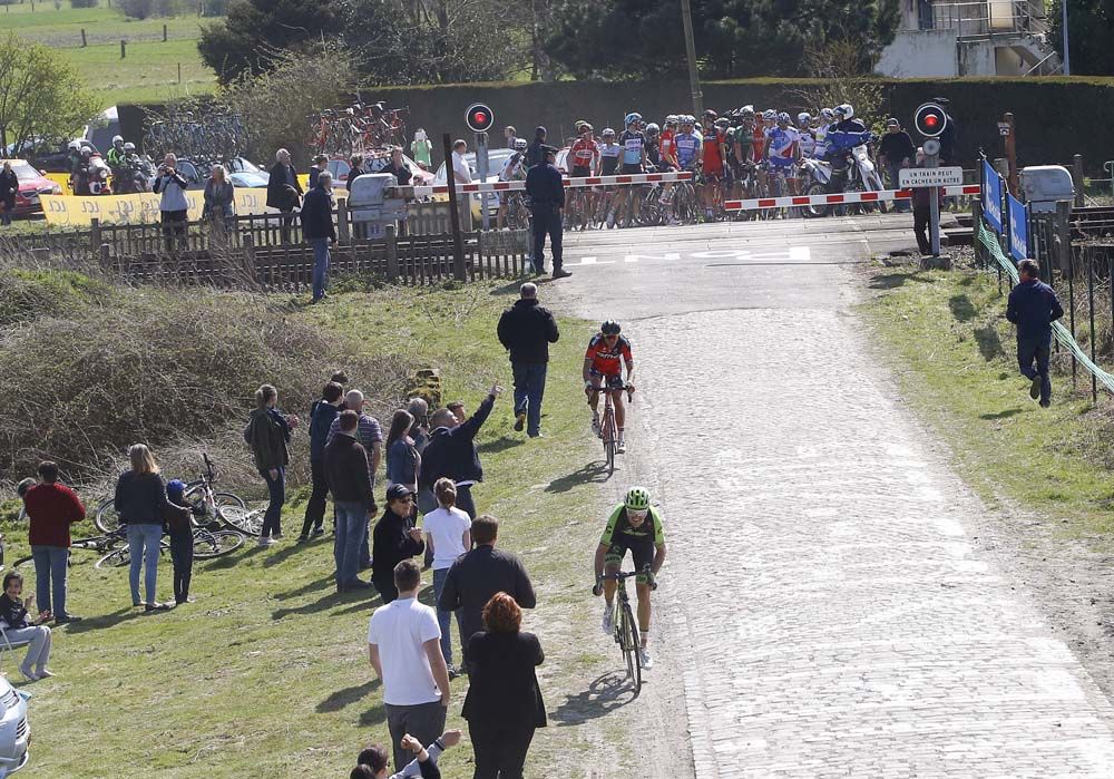 Some riders ignored a police officer and crossed with the barriers down