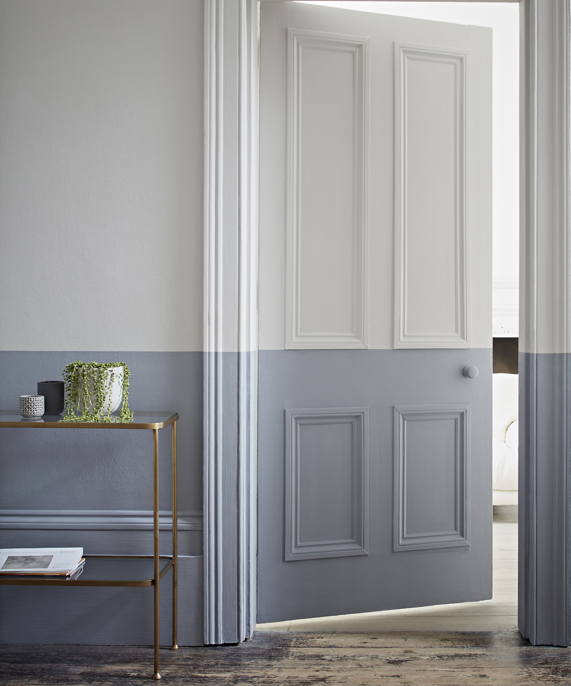 Hallway ideas by Crown using pastel blue and white emulsion paint in a half and half decor design