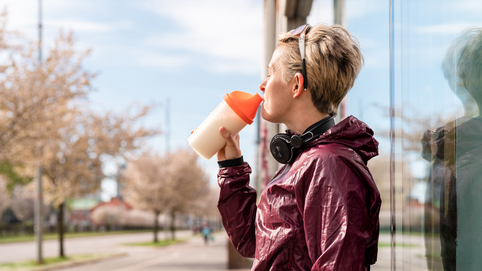 woman drinking a protein shake using the best vegan protein