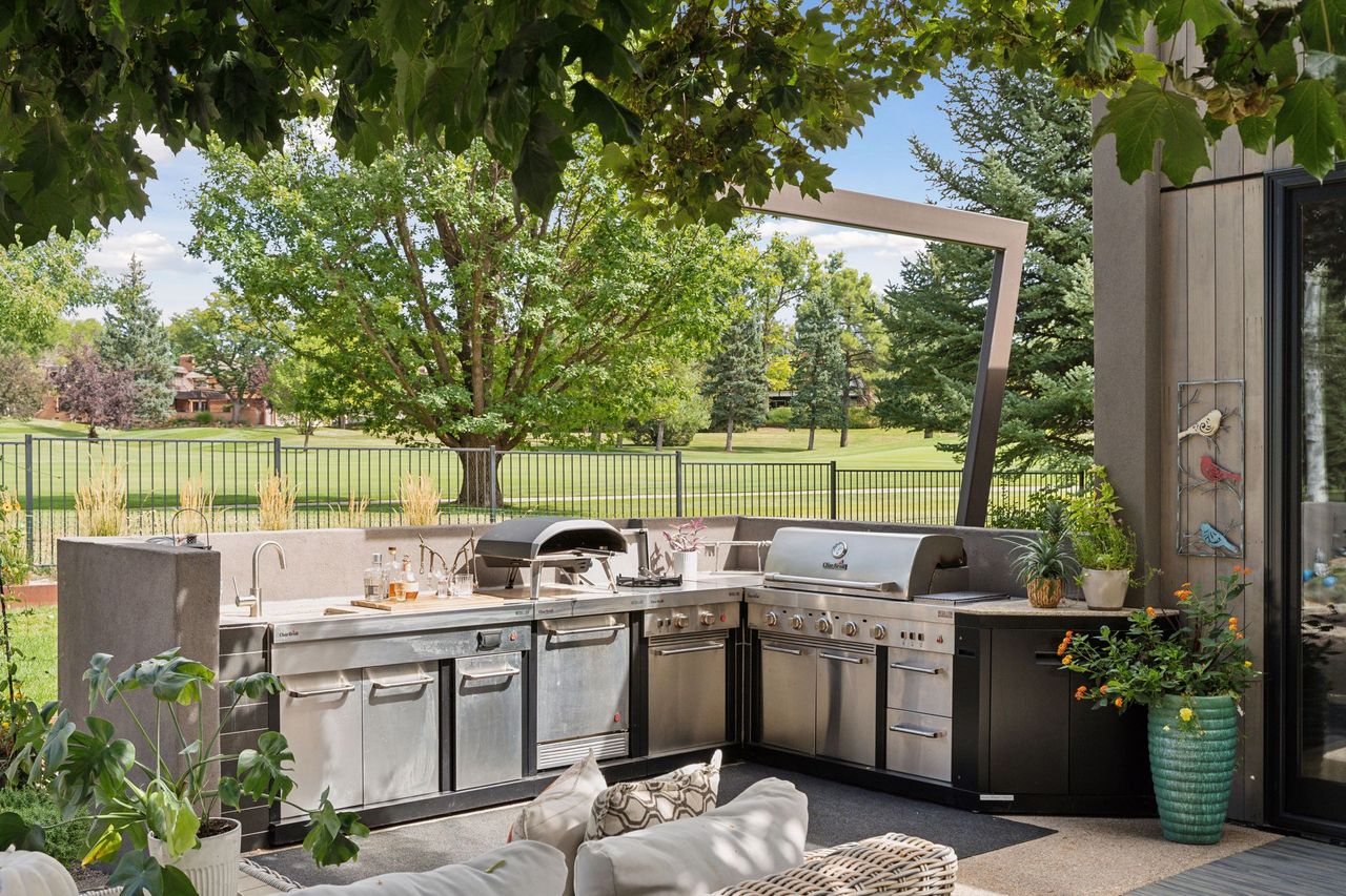 A modern home for sale in Boulder, Colorado by a golf course.