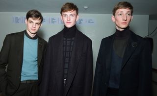 3 male models in black and blue clothes from Hermes AW15 collection