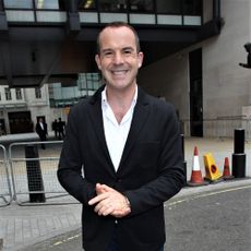 journalist martin lewis with black coat and white shirt