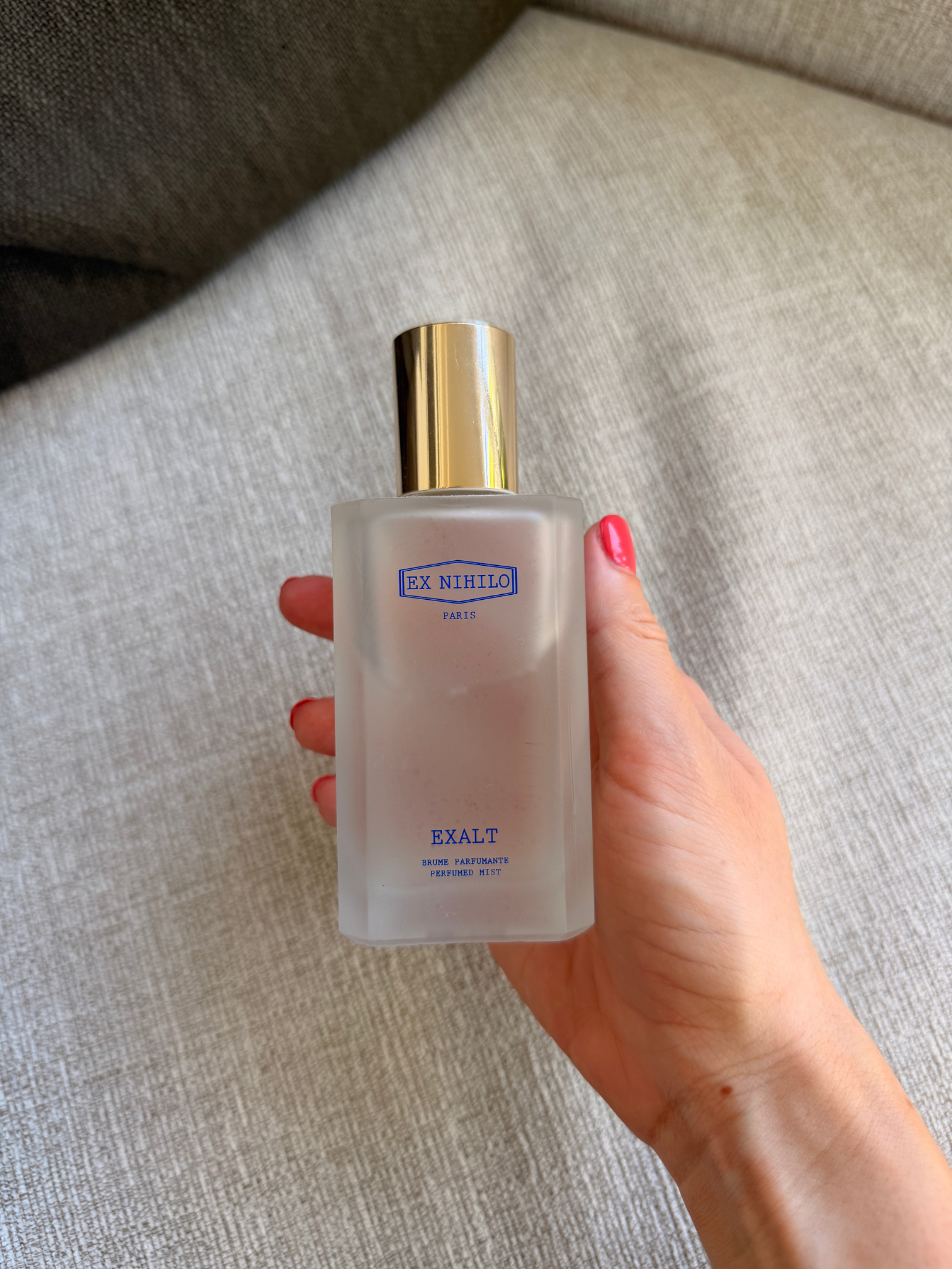 Grace Day holding the Ex Nihilo hair mist